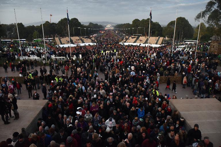 People stream into the Australian War Memorial after the dawn service on the 100th anniversary of the Gallipoli landings, in Canberra, on April 25, 2015