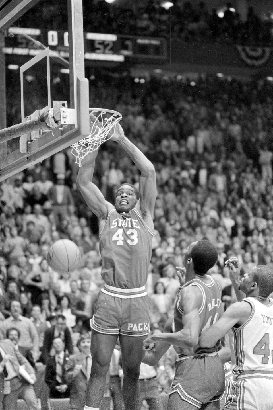 FILE - North Carolina State's Lorenzo Charles (43) dunks the ball with one second remaining against Houston in the NCAA Championship game in Albuquerque, N.M., April 4, 1983. NC State beat Houston 54-52. (AP Photo/File)