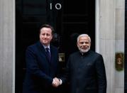 Prime Minister Narendra Modi's is greeted by Britain's Prime Minister David Cameron outside 10 Downing Street, in London, November 12, 2015. REUTERS/Peter Nicholls