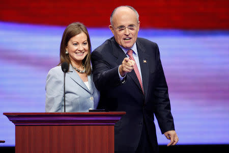 FILE PHOTO: Former Republican presidential candidate and past New York City Mayor Rudolph Giuliani checks out the podium with his wife Judith (L) in preparation for his speech at the 2008 Republican National Convention in St. Paul, Minnesota, U.S., September 2, 2008. REUTERS/Mike Segar/File Photo