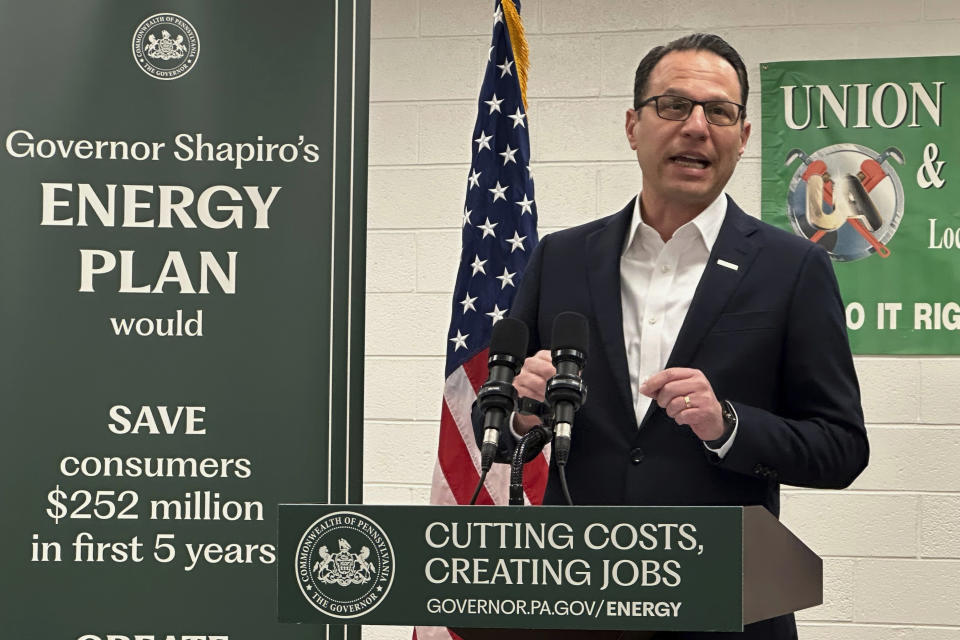 Pennsylvania Gov. Josh Shapiro speaks at a news conference at the United Association Local 524 union building in Scranton, Pa., on Wednesday, March 13, 2024. Shapiro announced he would back legislation to make power plant owners in Pennsylvania pay for their planet-warming greenhouse gas emissions and require utilities in the nation's third-biggest power-producer to buy more electricity from renewable sources. (AP Photo/Michael Rubinkam)