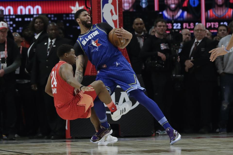 Lakers forward Anthony Davis is fouled by Kyle Lowry late in the All-Star Game on Sunday night. (AP Photo/Nam Huh)