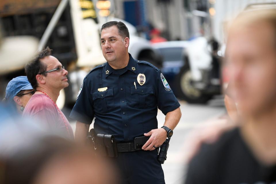 Knoxville Police Chief Paul Noel watches as demonstrators march along Gay Street in downtown Knoxville in support of abortion rights and in response to the overturning of Roe v. Wade on Friday, June 24, 2022. The U.S. Supreme Court ruled 6-3 Friday that Americans no longer have a constitutional right to abortion and erased a reproductive right the high court established nearly five decades ago.