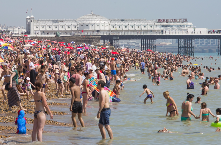 Thousands are flocking to the beach as the sun continues to bake Britain (Rex)