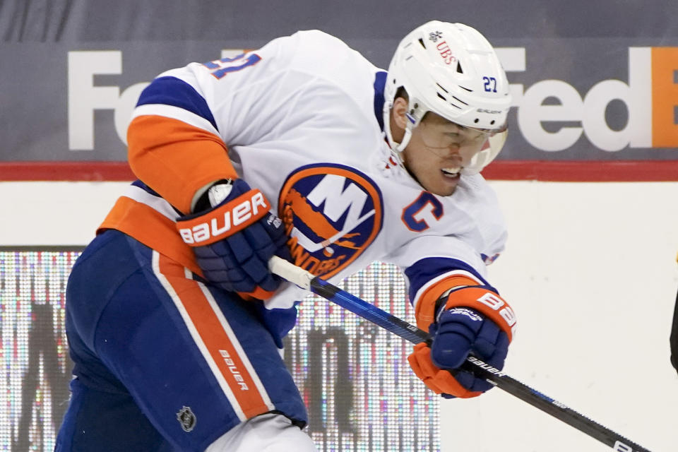 FILE - In this Feb. 18, 2021, file photo, New York Islanders' Anders Lee (27) plays against the Pittsburgh Penguins during an NHL hockey game in Pittsburgh. (AP Photo/Keith Srakocic, File)