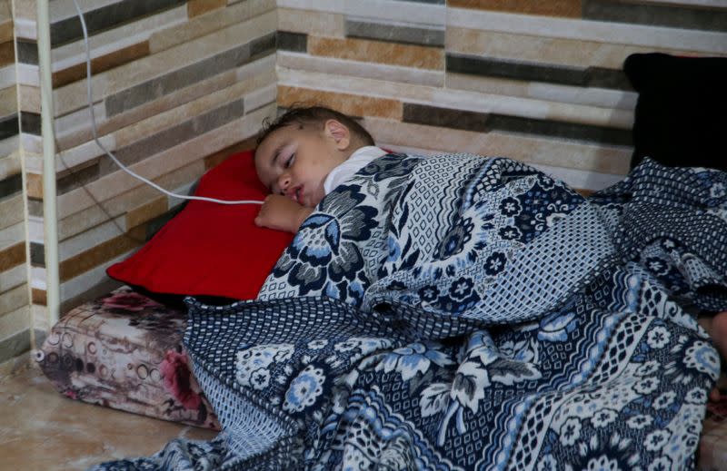 Sleepless Gazans keep children, and essential documents close to hand in Khan Younis