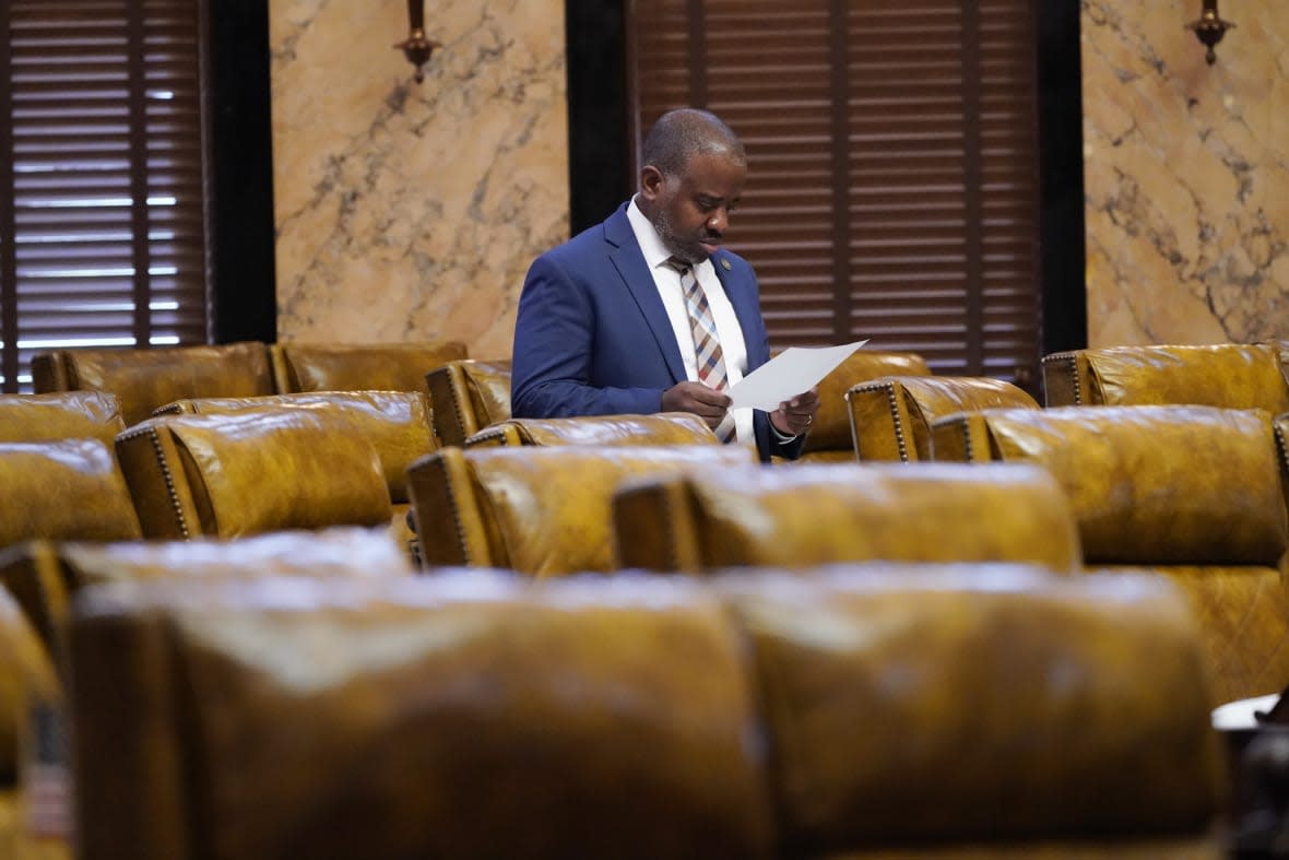 Rep. Ronnie Crudup Jr., D-Jackson, studies an updated grid of the total state support for agencies for fiscal year 2023, in the House chamber at the Mississippi Capitol in Jackson, Miss., on April 4, 2022. (AP Photo/Rogelio V. Solis, File)