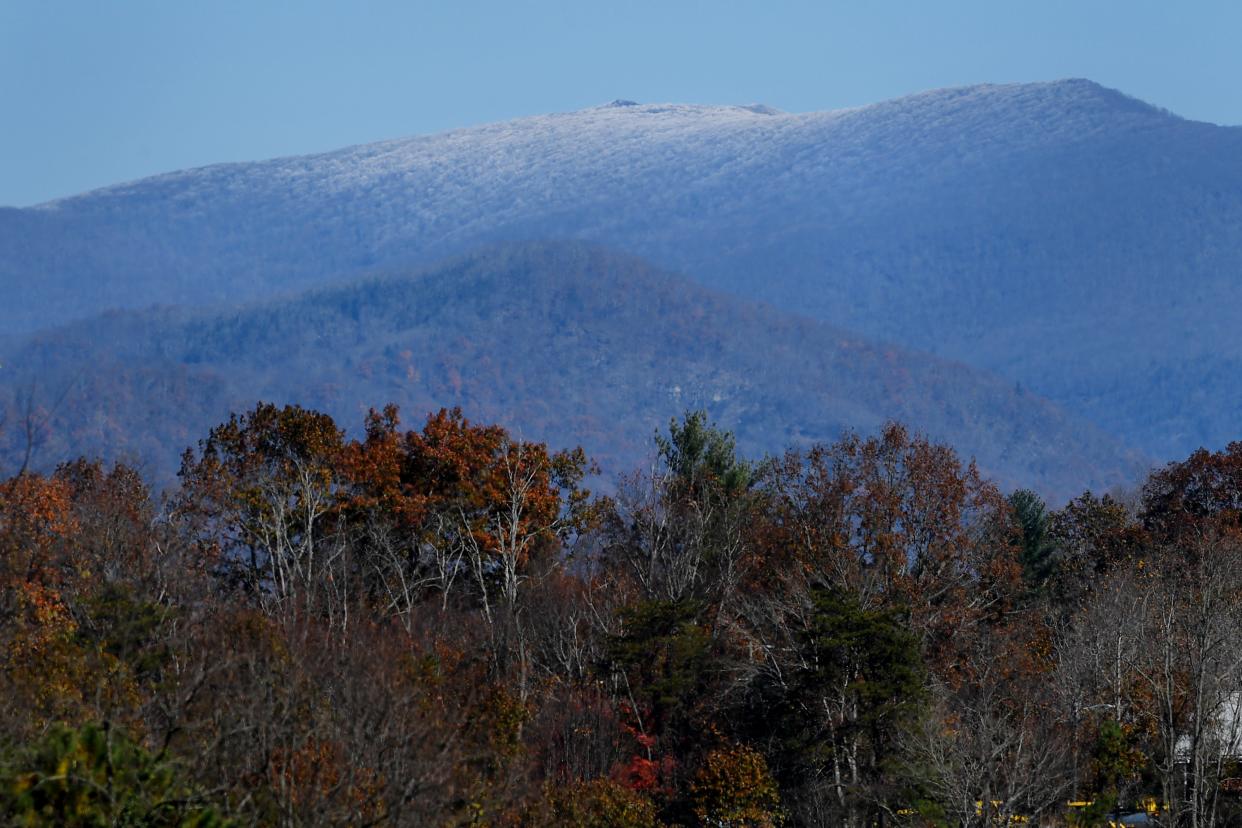 Snow is seen on a mountaintop from Asheville Nov. 10, 2018. The National Weather Service issued a winter storm warning and a winter weather advisory for Buncombe and nearby counties starting at 7 p.m. on Feb. 11 and lasting until midnight Feb. 12.