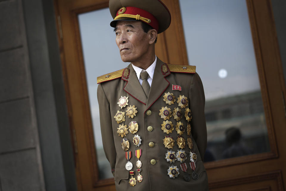 North Korean war veteran Kim Jae Pung, 78, a retired general, is decorated with medals as he attends a parade to celebrate the anniversary of the Korean War armistice agreement, Sunday, July 27, 2014, in Pyongyang, North Korea. North Koreans gathered at Kim Il Sung Square as part of celebrations for the 61st anniversary of the armistice that ended the Korean War. (AP Photo/Wong Maye-E)