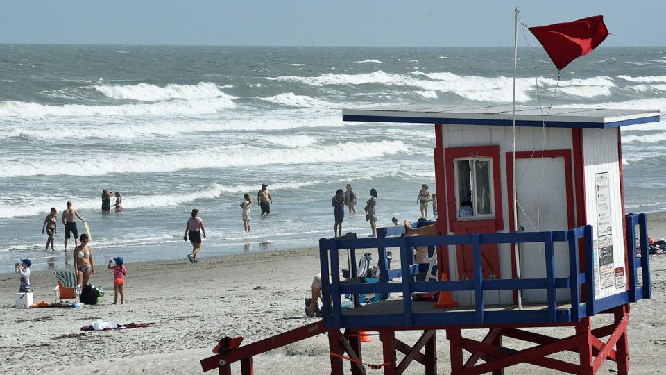 A high-hazard red flag is flown at a lifeguard tower at Cocoa Beach, Florida, on Sept. 14, 2019.