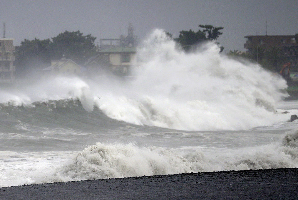 In this Sept. 8, 2019, photo, a high wave hits beach as typhoon approaches in Shizuoka city, central Japan. (Kyodo News via AP)