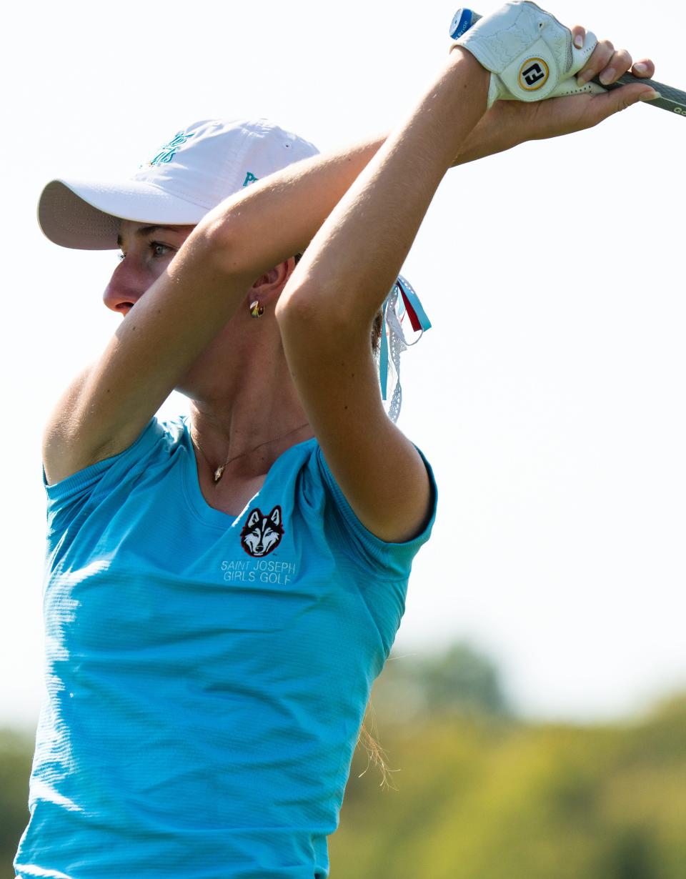 South Bend Saint Joseph’s Marley Dunham tees off on hole three Friday, Oct. 4, 2024, during round one of the 2024-25 IHSAA girls golf state championships at Prairie View Golf Club in Carmel, Indiana.