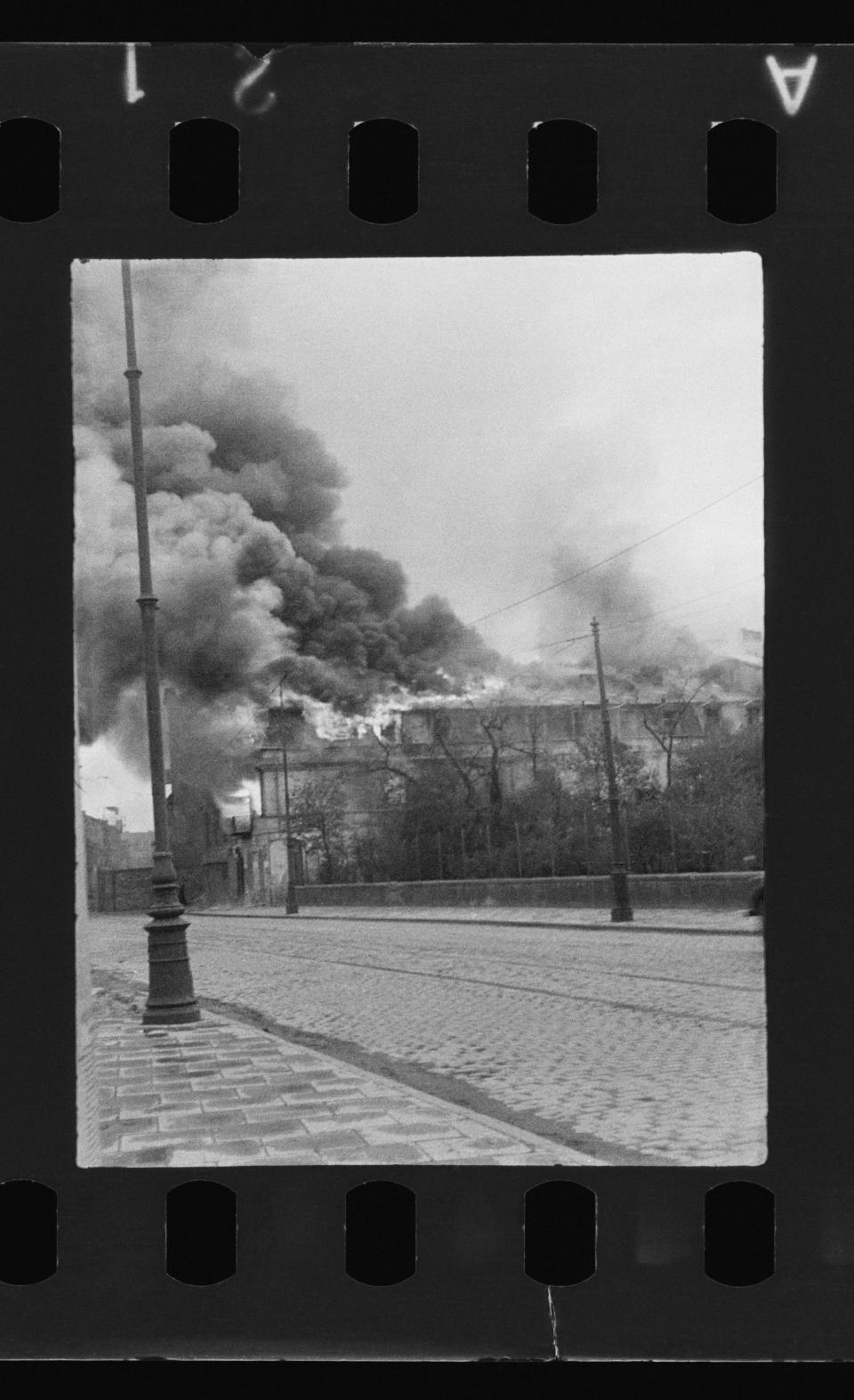 This undated handout negative taken by Polish firefighter Zbigniew Leszek Grzywaczewski negative shows the ghetto of Warsaw during the uprising of 1943, in Warsaw, Poland. On Wednesday, Jan. 18, 2023, Warsaw’s Jewish history museum presented a group of photographs taken in secret during the Warsaw Ghetto Uprising of 1943, some of which have never been seen before, that were recently discovered in a family collection. (Z. L. Grzywaczewski/courtesy of Maciej Grzywaczewski/POLIN Museum via AP)
