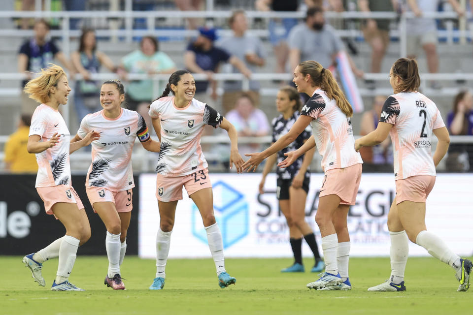 Jun 11, 2022; Louisville, Kentucky, USA;  Angel City FC teammates celebrate a goal made by Angel City FC forward Christen Press (23) against Racing Louisville FC during the second half at Lynn Family Stadium. Mandatory Credit: Aaron Doster-USA TODAY Sports