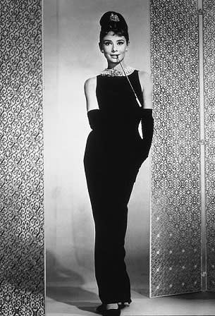 Photo by: IMDB<br>Audrey Hepburn in Givenchy in â€œBreakfast at Tiffanyâ€™sâ€ (1961)-<br>One of the most iconic images in modern cinema is Audrey Hepburn wearing this stunning black dress by Givenchy. It may just be the most famous dress on Earth. Nearly 50 years later, women still rely on their â€œlittle black dressâ€ for formal occasions.