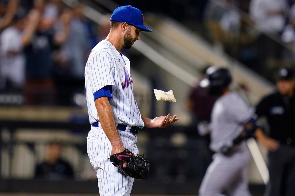 New York Mets starting pitcher David Peterson tosses a rosin bag as New York Yankees' Gleyber Torres runs the bases after hitting a two-run home run during the eighth inning of a baseball game Wednesday, July 27, 2022, in New York. (AP Photo/Frank Franklin II)