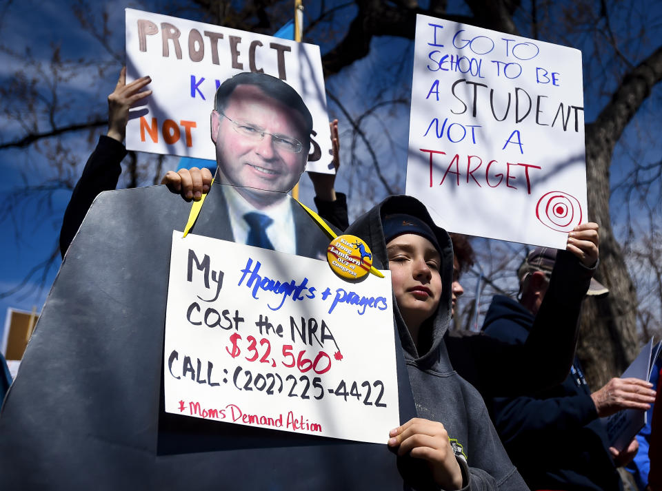 <p>Ben Heiman, 10, holds a cutout of Republican Doug Lamborn who was a former Republican for the House of Representative for Colorado’s 5th District during the ‘March For Our Lives’ eventin Colorado Springs, Colo. (Dougal Brownlie/The Gazette via AP) </p>