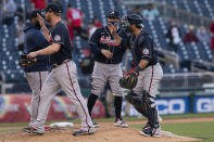 Atlanta Braves catcher Jeff Mathis, right, celebrates with teammates after winning a baseball game against the Washington Nationals in Washington, Thursday, May 6, 2021. (AP Photo/Manuel Balce Ceneta)