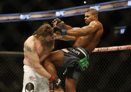 Alistair Overeem knees Roy Nelson in the stomach during their fight on Saturday. (USAT)