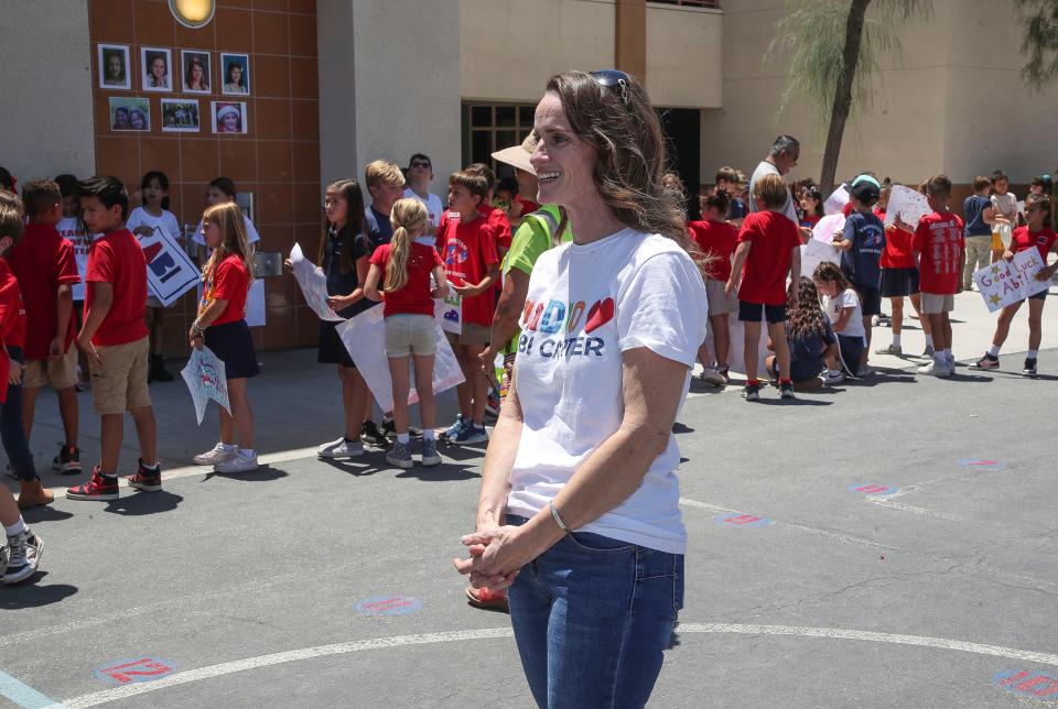 Andrea Carter, mother of American Idol finalist Abi Carter, looks on as her daughter receives a boisterous welcome from the students at George Washington Charter School in Palm Desert, Calif., May 14, 2024.