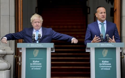 Boris Johnson gesticulates while Leo Varadkar, Ireland's prime minister, speaks at a joint press conference - Credit: Bloomberg&nbsp;