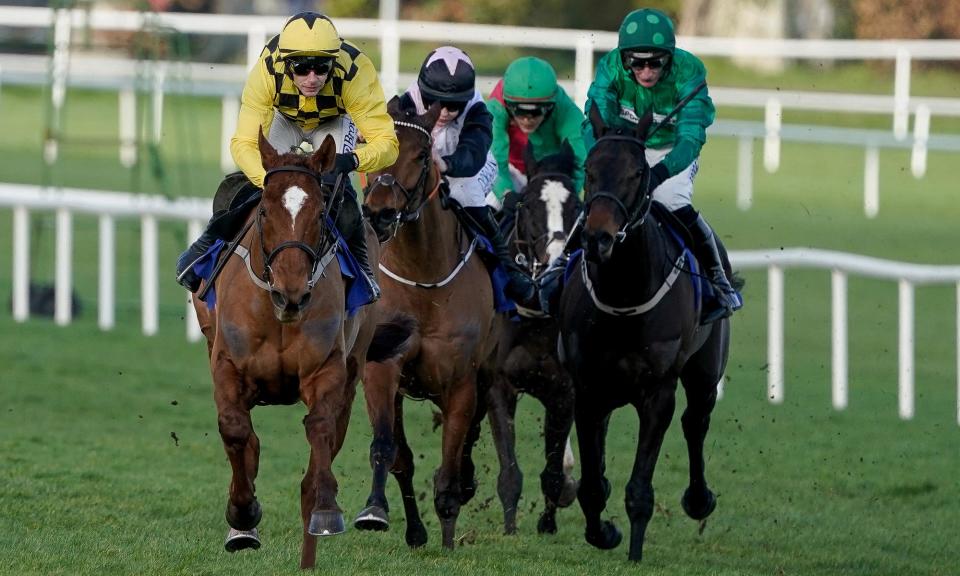 <span>State Man (yellow), with Paul Townend on board, goes on to win the Irish Champion Hurdle at Leopardstown.</span><span>Photograph: Alan Crowhurst/Getty Images</span>