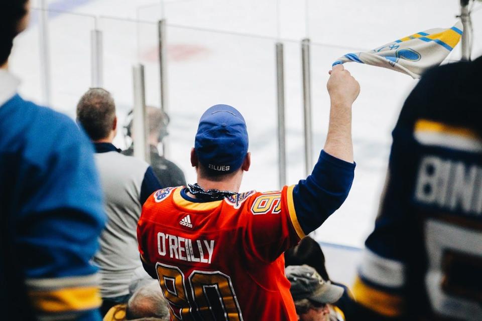 A fan waves his rally towel during the St. Louis Blues’ home playoff game against the Minnesota Wild on Friday at the Enterprise Center in St. Louis.