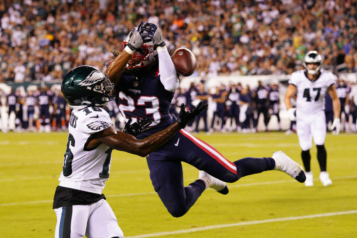 New England Patriots' Kyle Dugger blocks a pass intended for Philadelphia Eagles' Quez Watkins. (AP Photo/Chris Szagola)