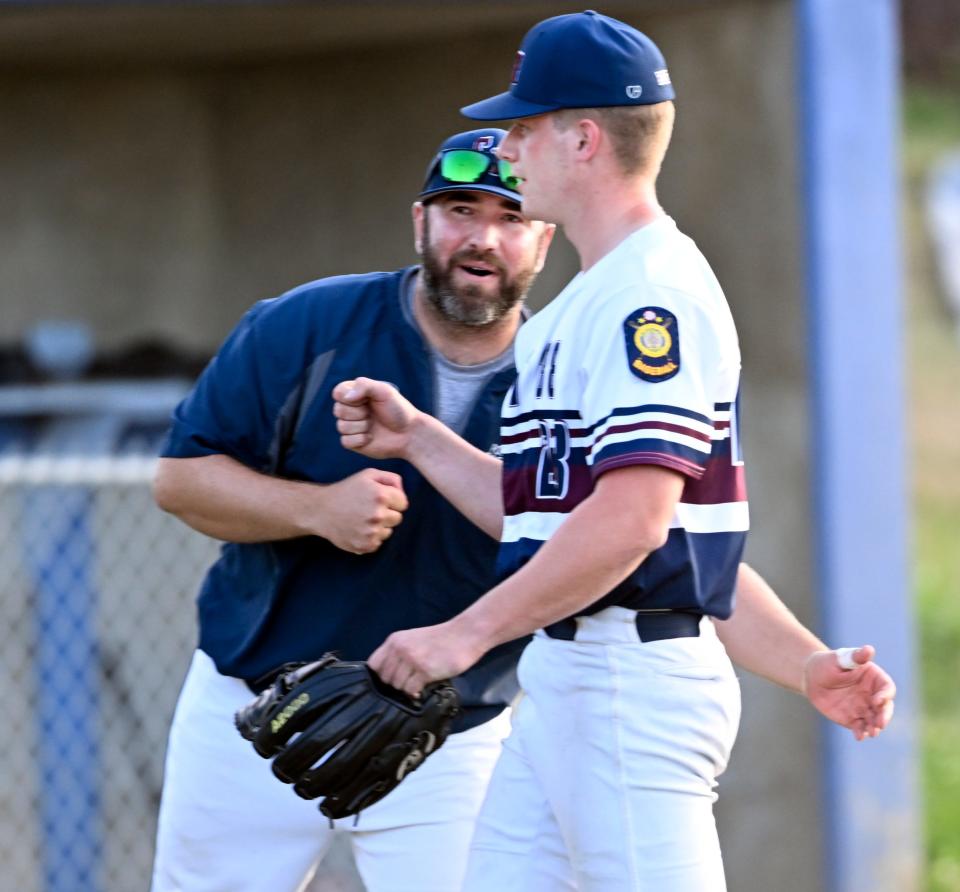 Sandwich Post 188 closer and winning pitcher Liam Howell gets a welcome celebration from head coach Brian Tomasini after the final out in a 4-1 win over Rockland Post 147 Wednesday in Sandwich.