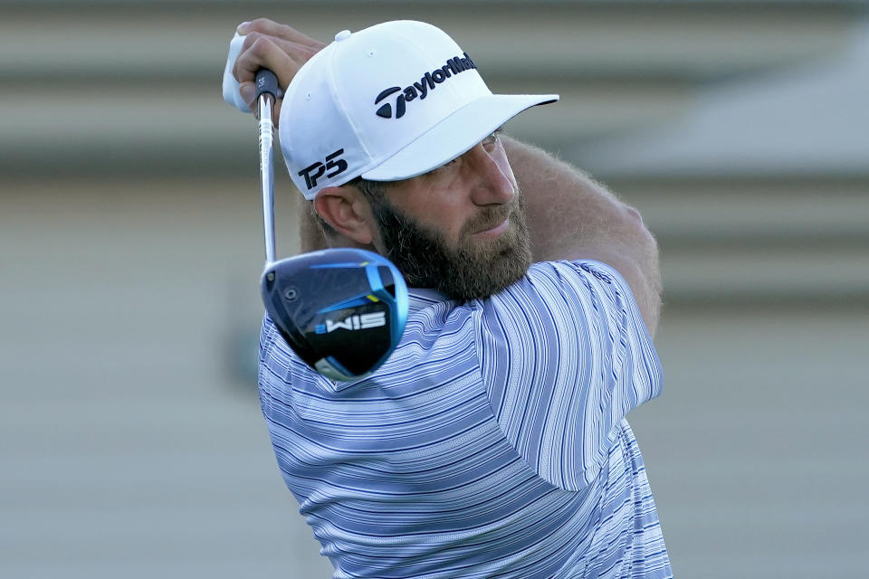 Dustin Johnson plays his shot from the first tee during a practice round prior to the Tournament of Champions golf event, Wednesday, Jan. 6, 2021, at Kapalua Plantation Course in Kapalua, Hawaii. (AP Photo/Matt York)