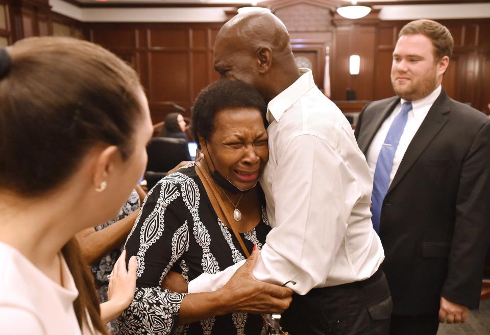 Edward Taylor and his mother, Agnes Anderson, hug as they prepare to leave the courtroom after the last step in clearing Taylor's criminal record on May 20.