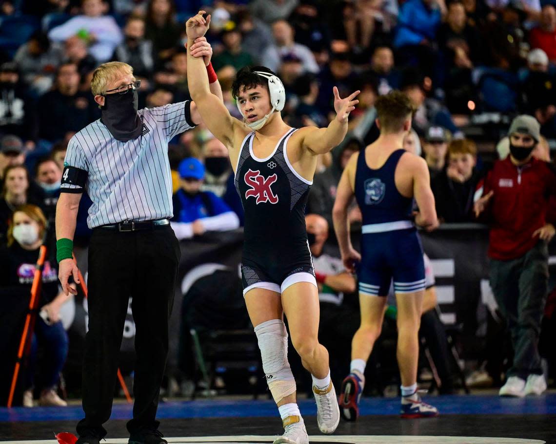 South Kitsap’s Mitchell Neiner celebrates after beating Gonzaga Prep’s Joshua Neiwert, 3-2, in the126 -pound 4A championship match at Mat Classic XXXIII on Saturday, Feb. 19, 2022, at the Tacoma Dome in Tacoma, Wash.