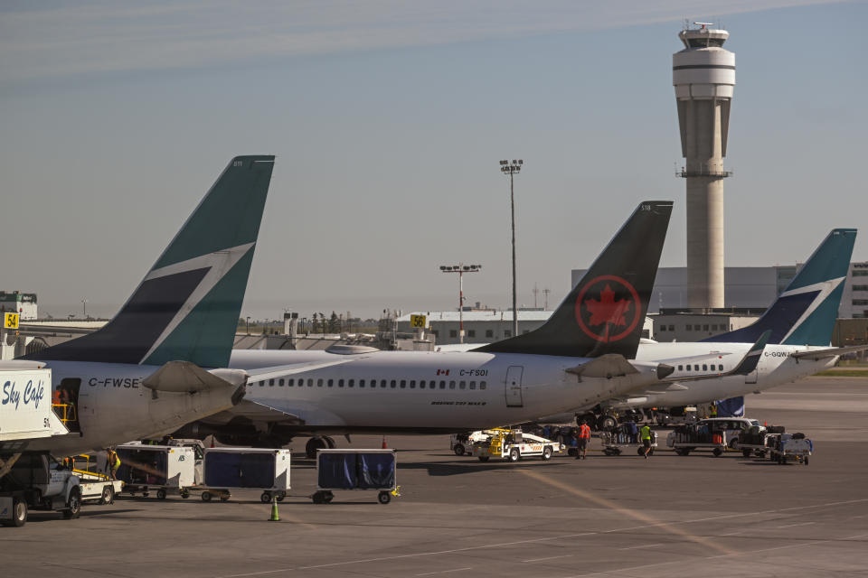 CALGARY, CANADA - AUGUST.14, 2023:
Air Canada and WestJet aircraft seen at Calgary International Airport, on August 14, 2023, in Calgary, Canada. (Photo by Artur Widak/NurPhoto via Getty Images)