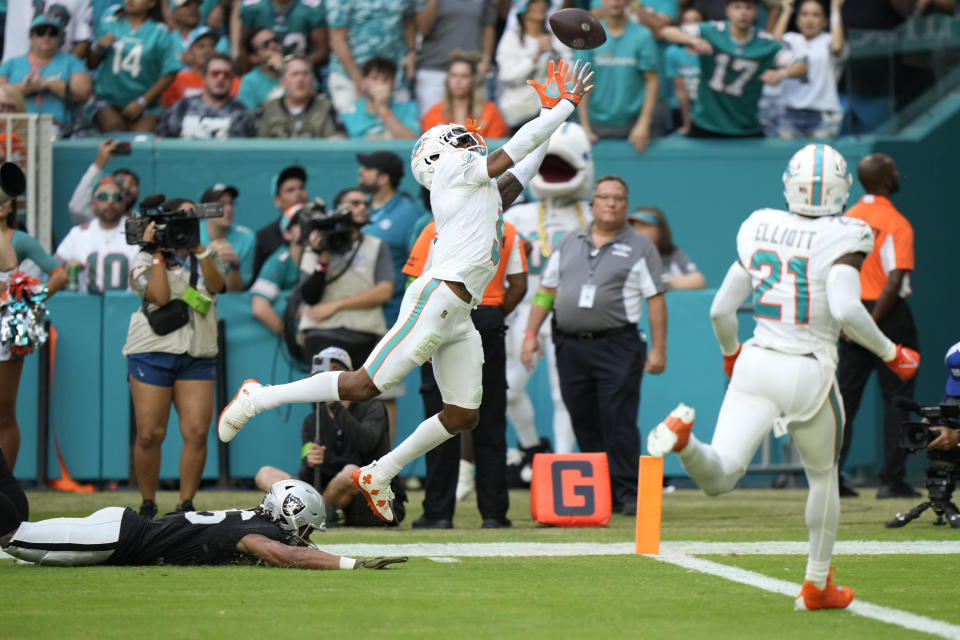 Miami Dolphins cornerback Jalen Ramsey (5) attempts to intercept a pass intended for Las Vegas Raiders wide receiver Jakobi Meyers (16) during the second half of an NFL football game, Sunday, Nov. 19, 2023, in Miami Gardens, Fla. (AP Photo/Wilfredo Lee)