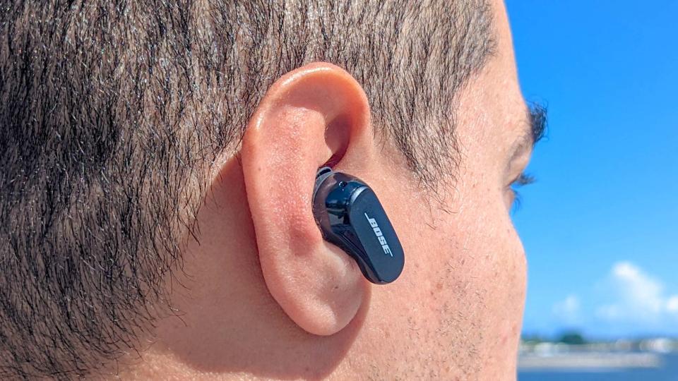 Close up image of reviewer wearing Bose QuietComfort Earbuds 2