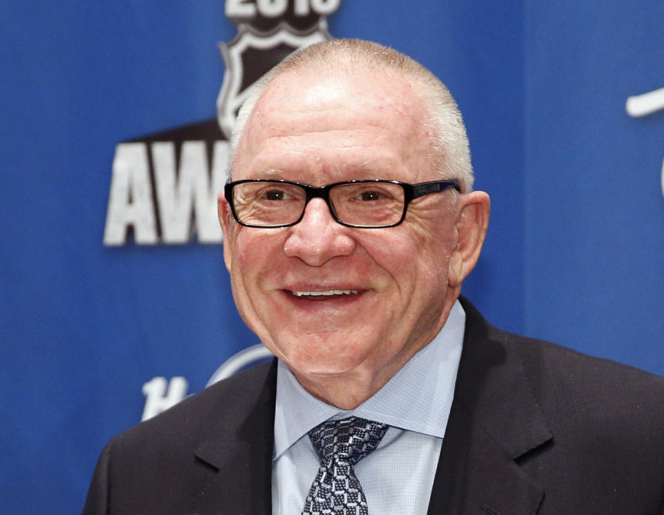 FILE - In this June 22, 2016, file photo, Pittsburgh Penguins general manager Jim Rutherford holds the General Manager of the Year trophy after winning the award at the NHL Awards show, in Las Vegas. Rutherford was elected to the Hockey Hall of Fame, Tuesday, June 25, 2019. (AP Photo/John Locher, File)