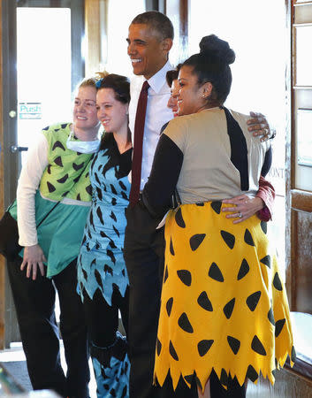 U.S. President Barack Obama poses with employees during Halloween at Gregg's Restaurant in Providence, Rhode Island, October 31, 2014. REUTERS/Larry Downing