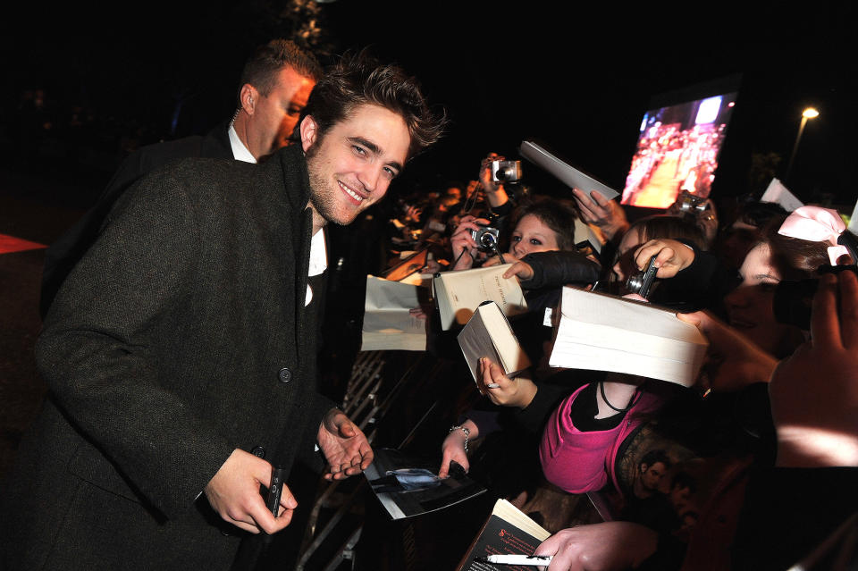 <p>Much like a plant seeks the sun, Pattinson's hair seems to bend ever so slightly toward his adoring fans.</p>