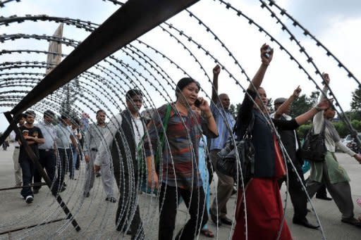 Nepalese lawmakers chant slogans against their leaders as they rally within the constituent assembly premises in Kathmandu. The leader of Nepal's Maoists has called for rival parties to join a national unity government to take the country to fresh elections and said he was open to a change of prime minister