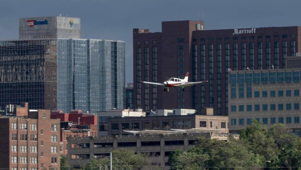 A Piper Cherokee prepares to land at the Charles B. Wheeler Downtown Airport. The airport’s location close to downtown means that any construction over 200 feet in the flightpaths around the airport must be reviewed by the FAA.