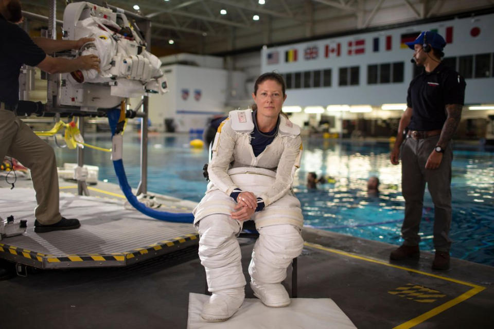 Runner up: NASA astronaut Tracy Caldwell Dyson takes a moment's rest while dressed in her spacesuit before going under water in the Neutral Buoyancy Lab at NASA's Johnson Space Center