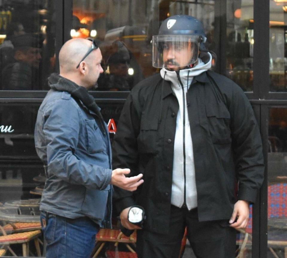 Benalla outside a cafe at the scene