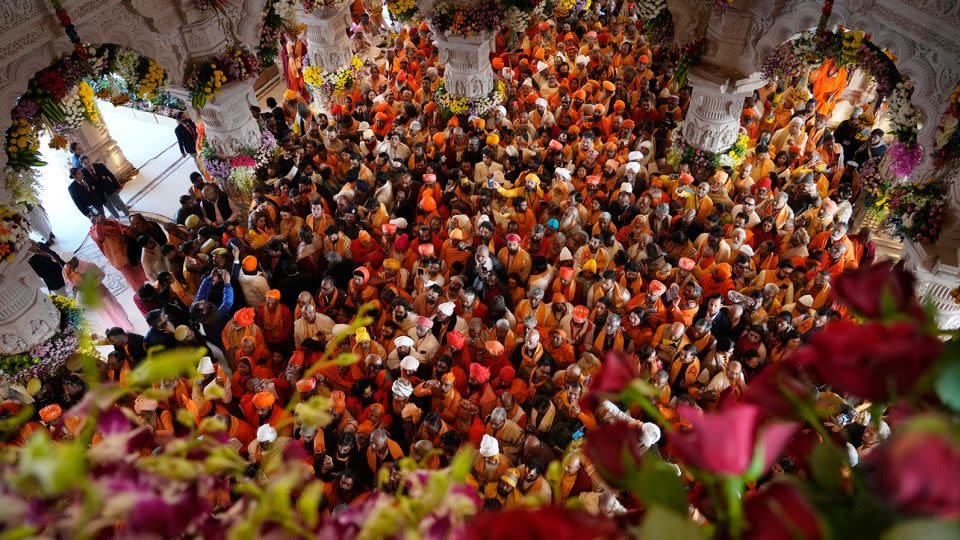 Hindu holy men throng to get the first look of the temple dedicated to Hinduism's Lord Ram soon after its inauguration in Ayodhya, January 22, 2024. - Rajesh Kumar Singh/AP