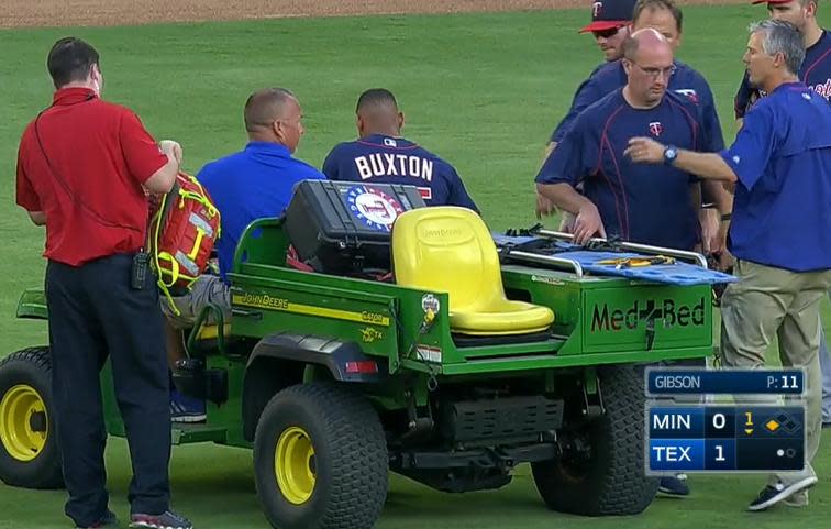 Twins outfielder Byron Buxton is carted off with a right knee injury after colliding with the outfield wall. (MLB)