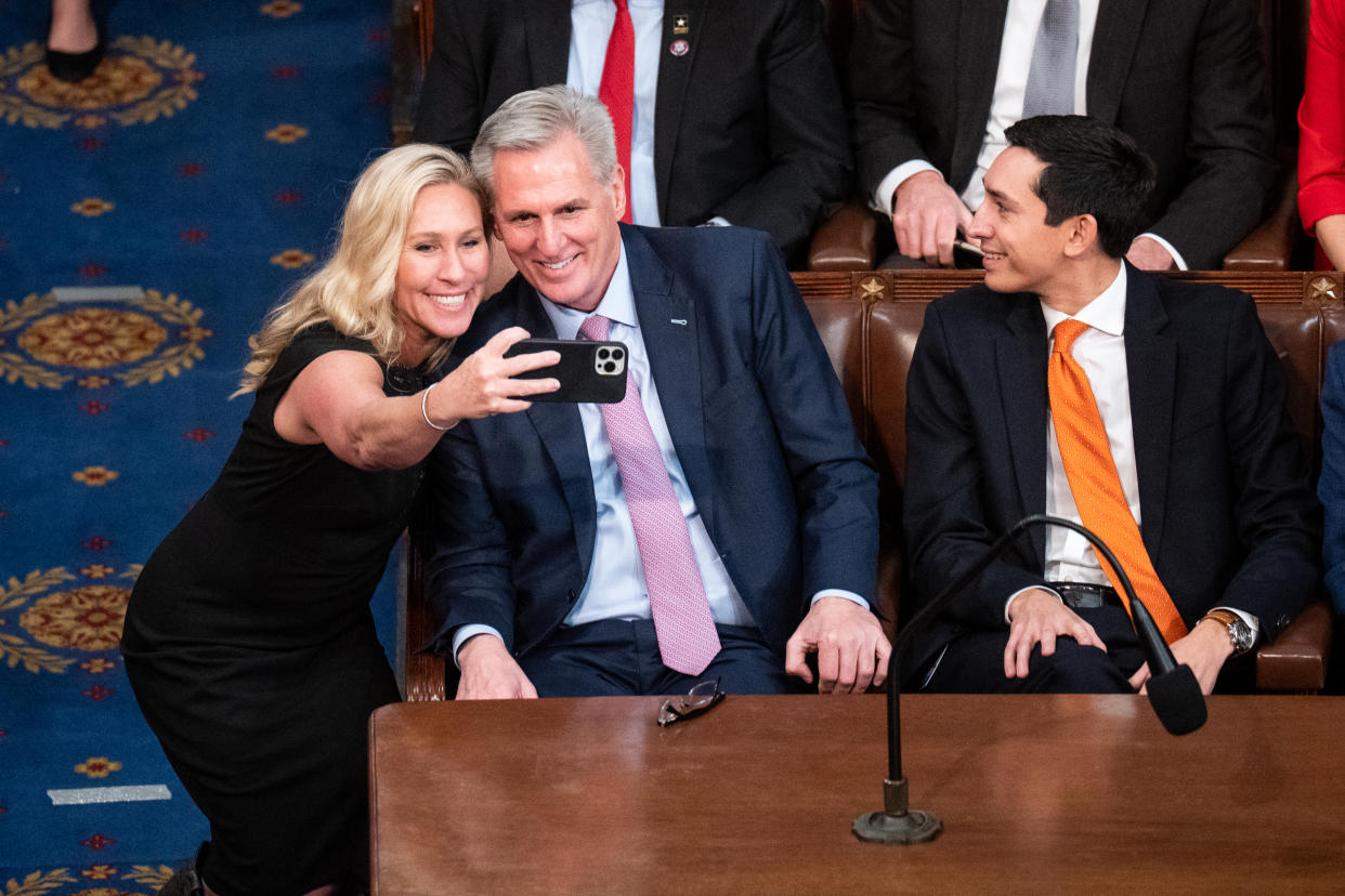 UNITED STATES - JANUARY 7: Rep. Marjorie Taylor Greene, R-Ga., takes a selife with Republican Leader Kevin McCarthy, R-Calif., at the end of the 15th vote after he received enough votes to become Speaker of the House early Saturday morning, January 7, 2023. (Bill Clark/CQ-Roll Call, Inc via Getty Images)