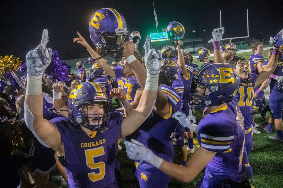 The Escalon varsity football team cheers their 20-13 victory over Hilmar to win the Sac Joaquin Section Division V championship game at St. Mary's High School in Stockton. 