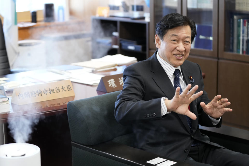 Japanese Environment Minister Tsuyoshi Yamaguchi speaks during an interview with The Associated Press Tuesday, Jan. 18, 2022, in Tokyo. Japan will gradually phase out coal plants over the next two decades while developing new technologies to reduce, capture and utilize carbon, Yamaguchi said Tuesday. (AP Photo/Eugene Hoshiko)