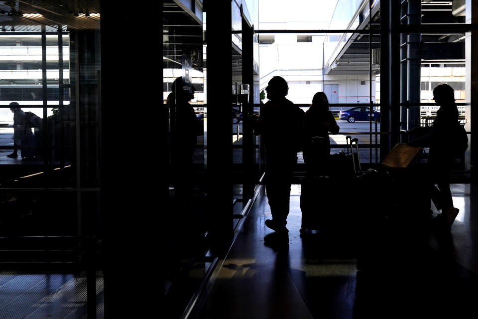 Travelers make their way toward Terminal 3 at O'Hare International Airport in Chicago, Thursday, Aug. 31, 2023. The Federal Aviation Administration predicts that this will be the third busiest holiday weekend of the year so far, behind only the Juneteenth weekend, which included Father's Day, and the Presidents Day break.(AP Photo/Nam Y. Huh)