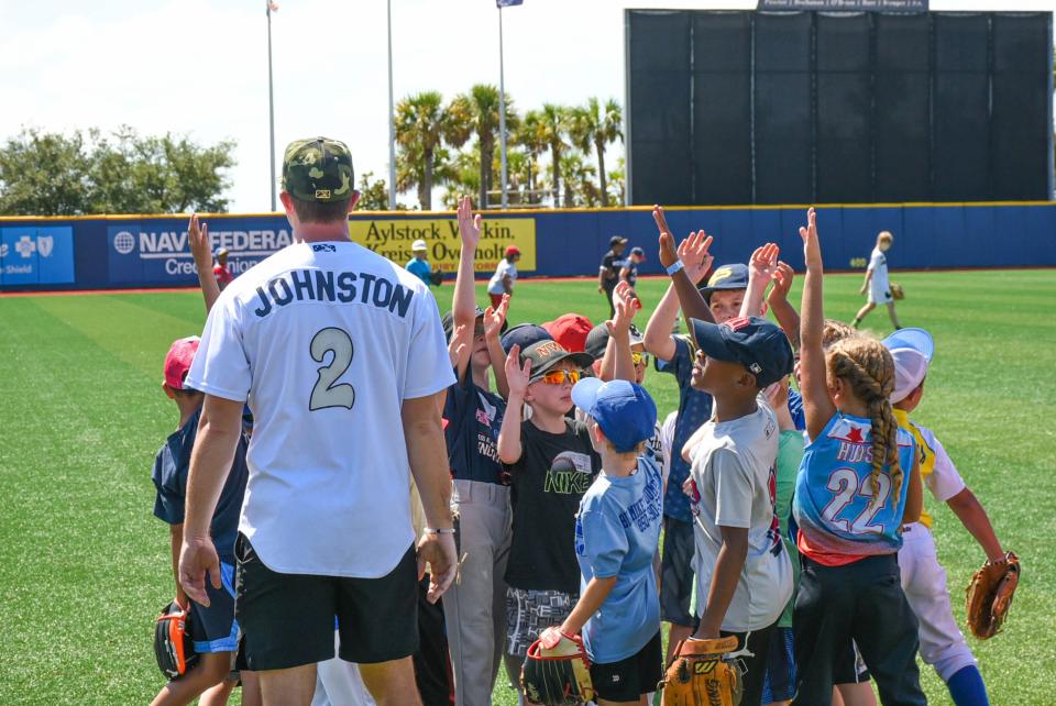 Blue Wahoos first baseman Troy Johnston with area youth league players at the July 16 Chevy Youth Baseball Clinic at Blue Wahoos Stadium.