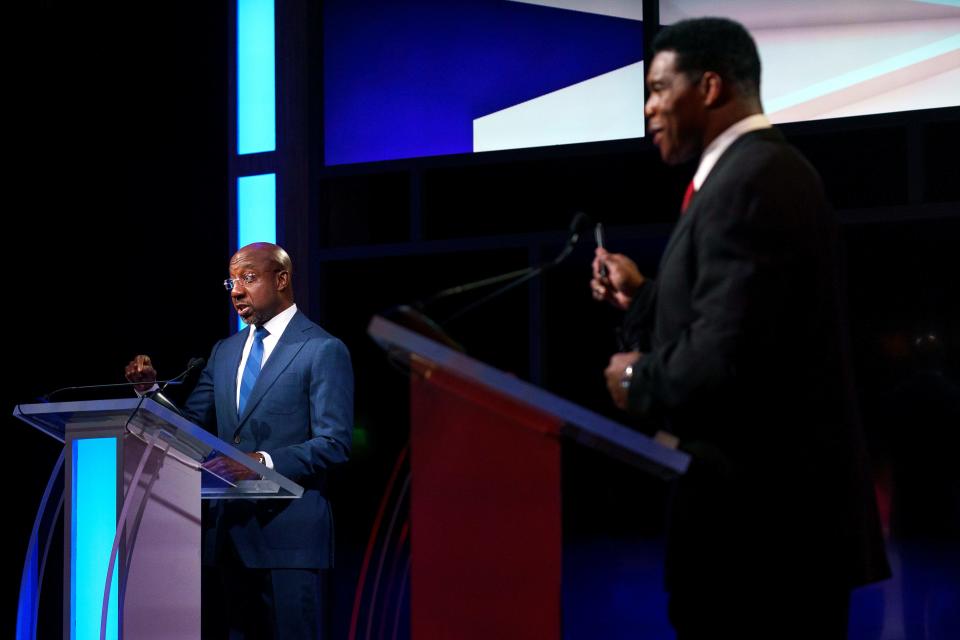 Sen. Raphael Warnock (D-Ga.) and Georgia Republican Senate candidate Herschel Walker participate in the Nexstar Georgia Senate Debate at District Live at Plant Riverside District in Savannah, Ga., on Friday, October 14, 2022.